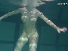 Find-Best-Pantyhose.com presents: Naked brunette with big tits swims solo
