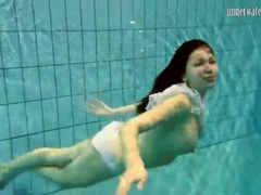 Find-Best-Pantyhose.com presents: Girl in white panties swims in pool
