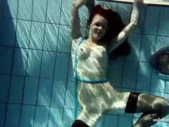 Find-Best-Pantyhose.com presents: In black stockings pretty girl goes for a swim