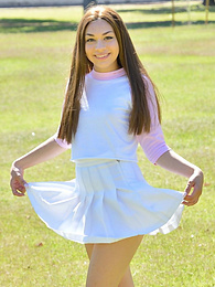 Find-Best-Pantyhose.com presents: Sexy youthful Kelly Kitten in skirt revealing small tits and toying her cunt outside